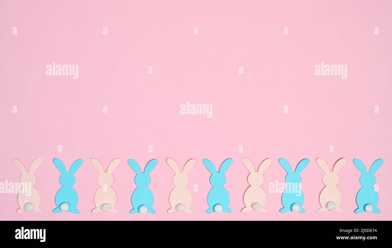 PAstel pink and blue rabbits on pastel pink background. Creative copy ...
