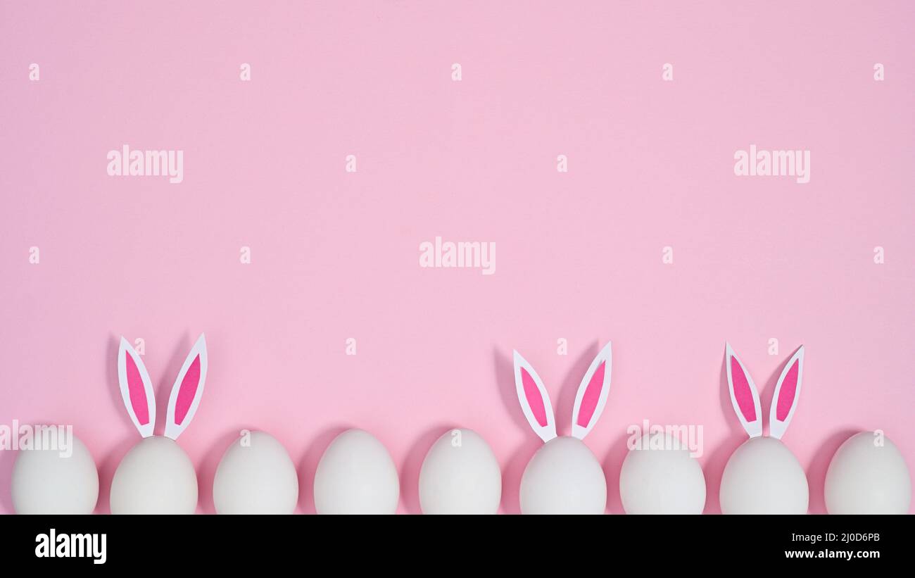 Creative Easter copy space background with eggs with bunny ears on ...