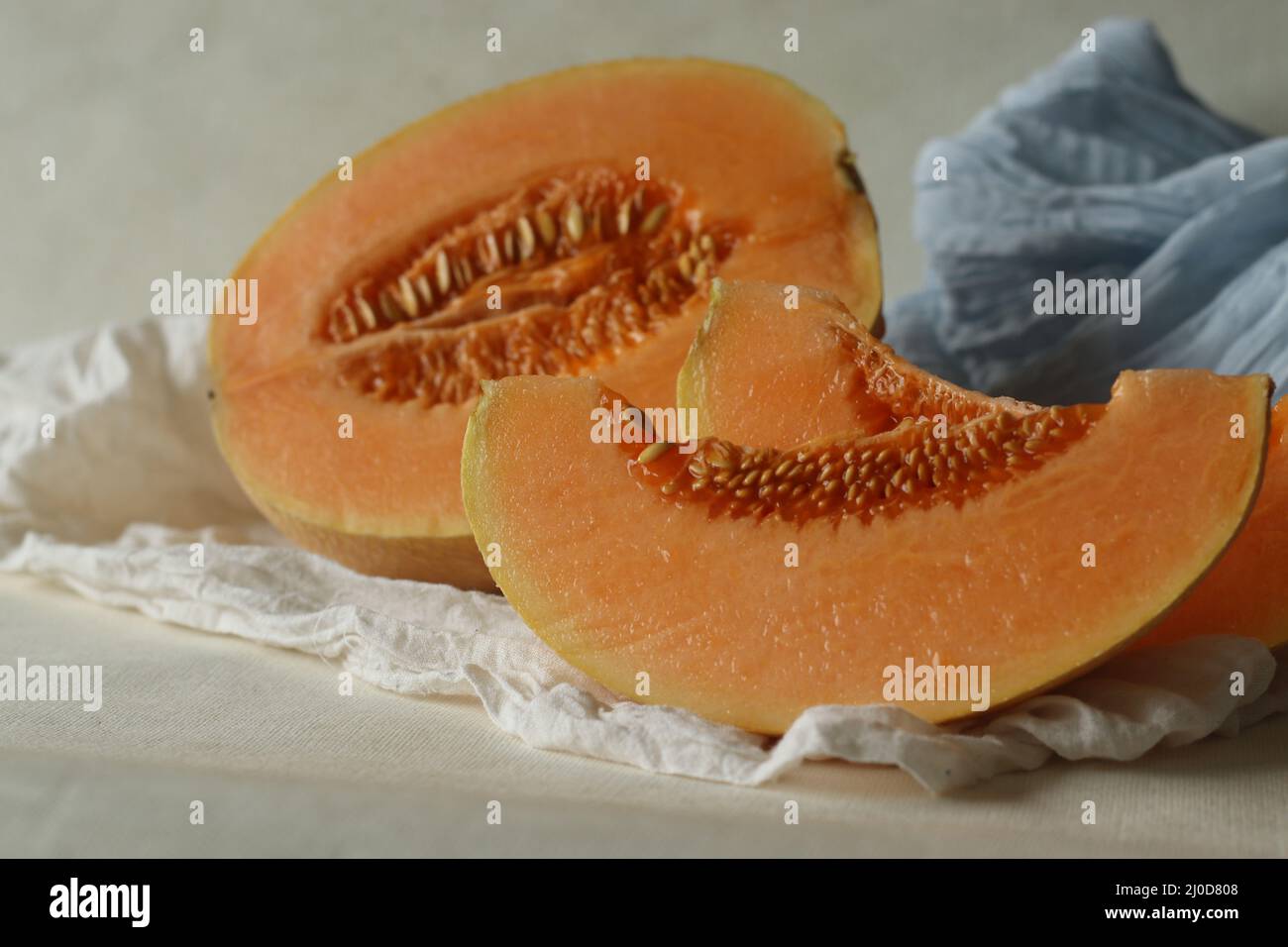 Muskmelon, also known as Cucumis melo, is a species of melon belongs to gourd family. It has ribbed, netted or smooth skin and a sweet, or bland flavo Stock Photo