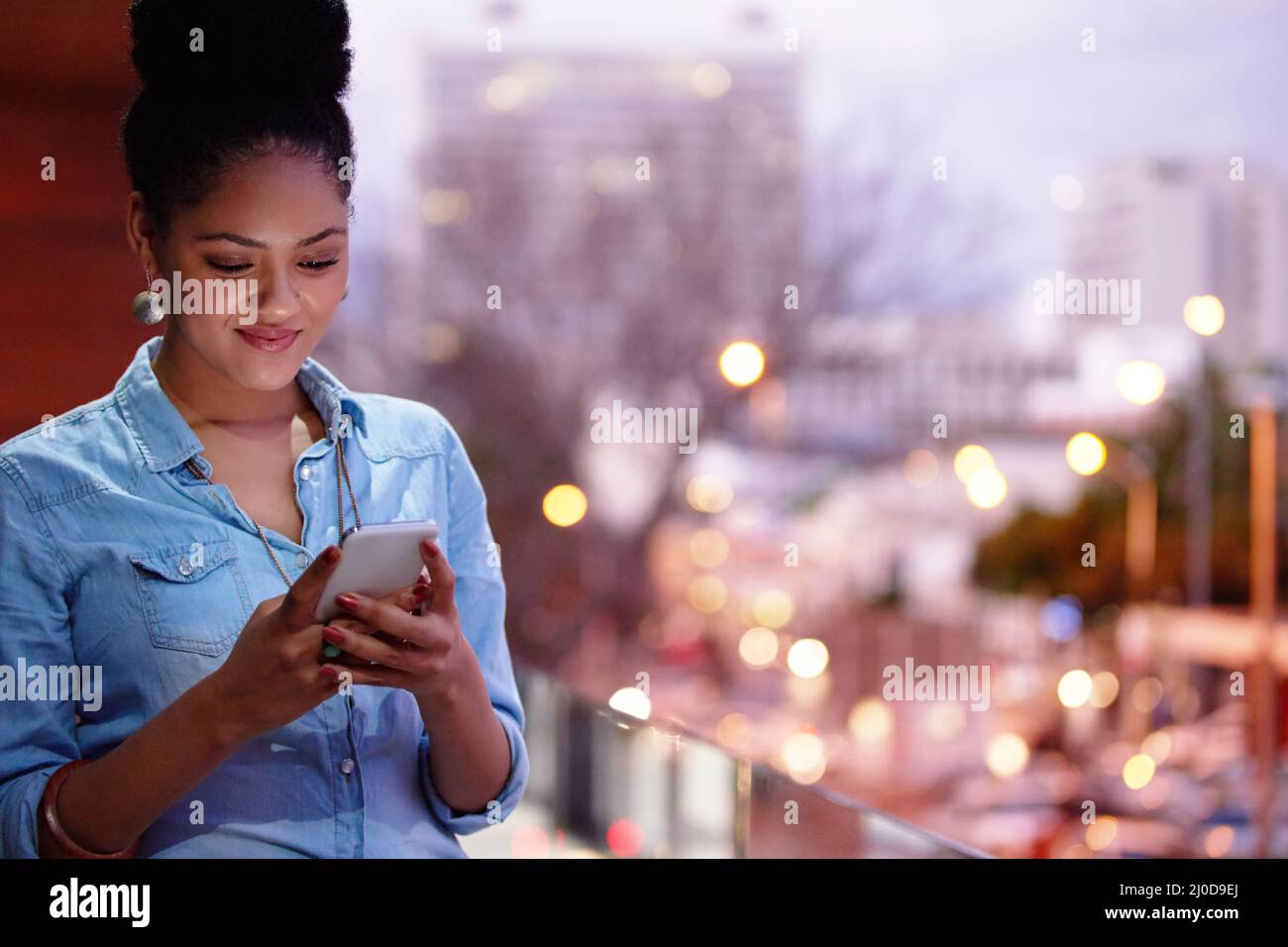Connect to the world out there. Shot of an attractive young designer at work. Stock Photo