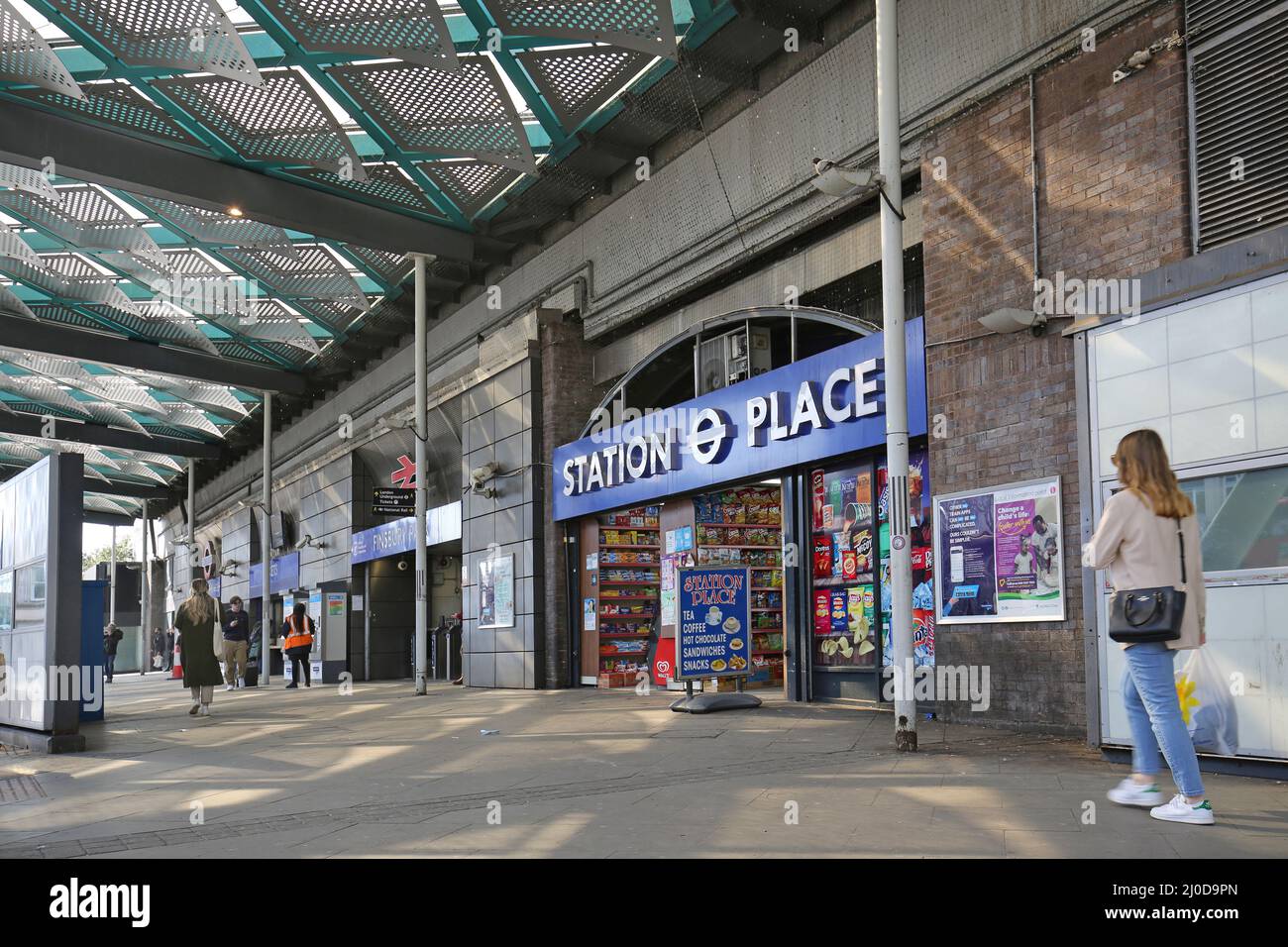 Entrance to Finsbury Park ststion in London, UK. Shows undercover area between bus stops and staion. London Underground and main line train services Stock Photo