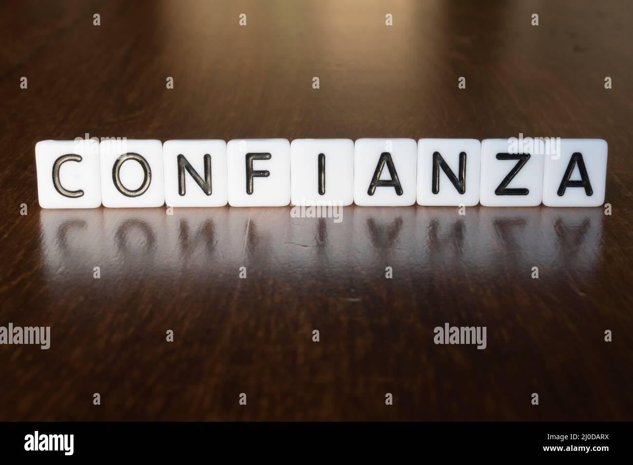Confidence concept. Word Confidence (Confianza) isolated on background. Stock Photo