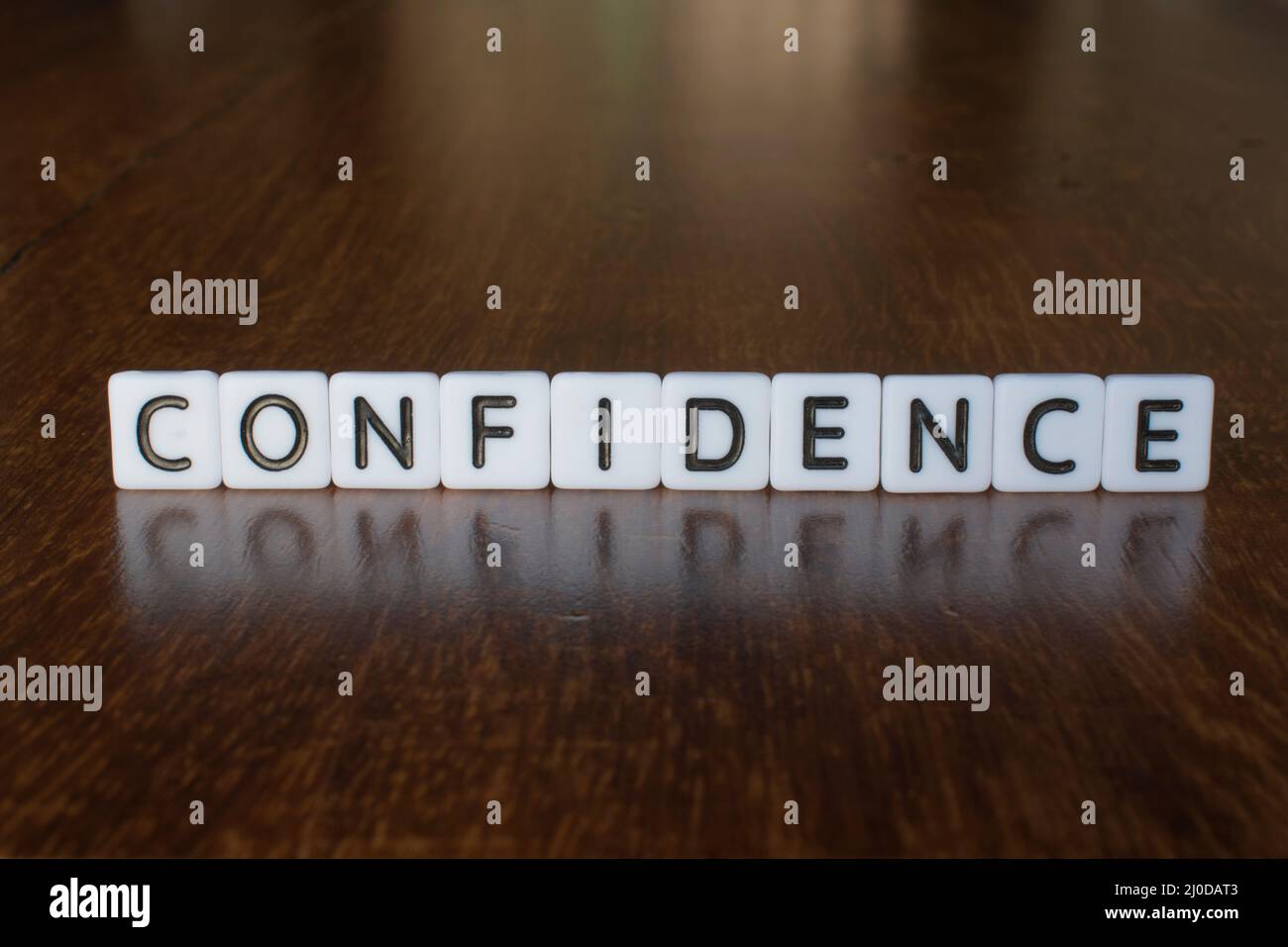 Confidence word written on blocks. Confidence concept Stock Photo