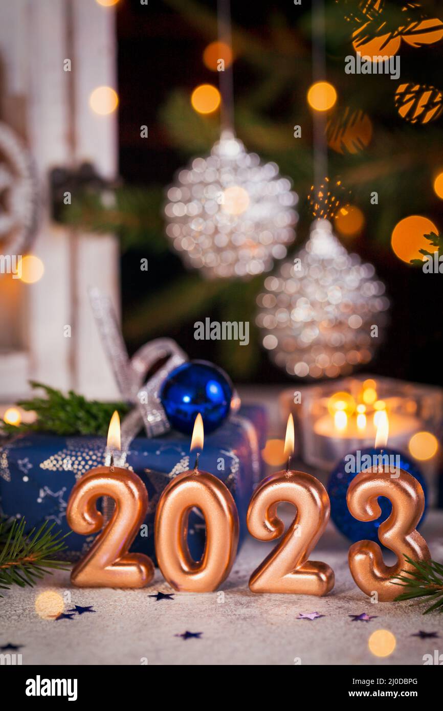Abstract Advent 2023 Background. Christmas card with holiday mood. Christmas Lantern With Fir Branch and Decoration with gifts And Defocused Lights Stock Photo