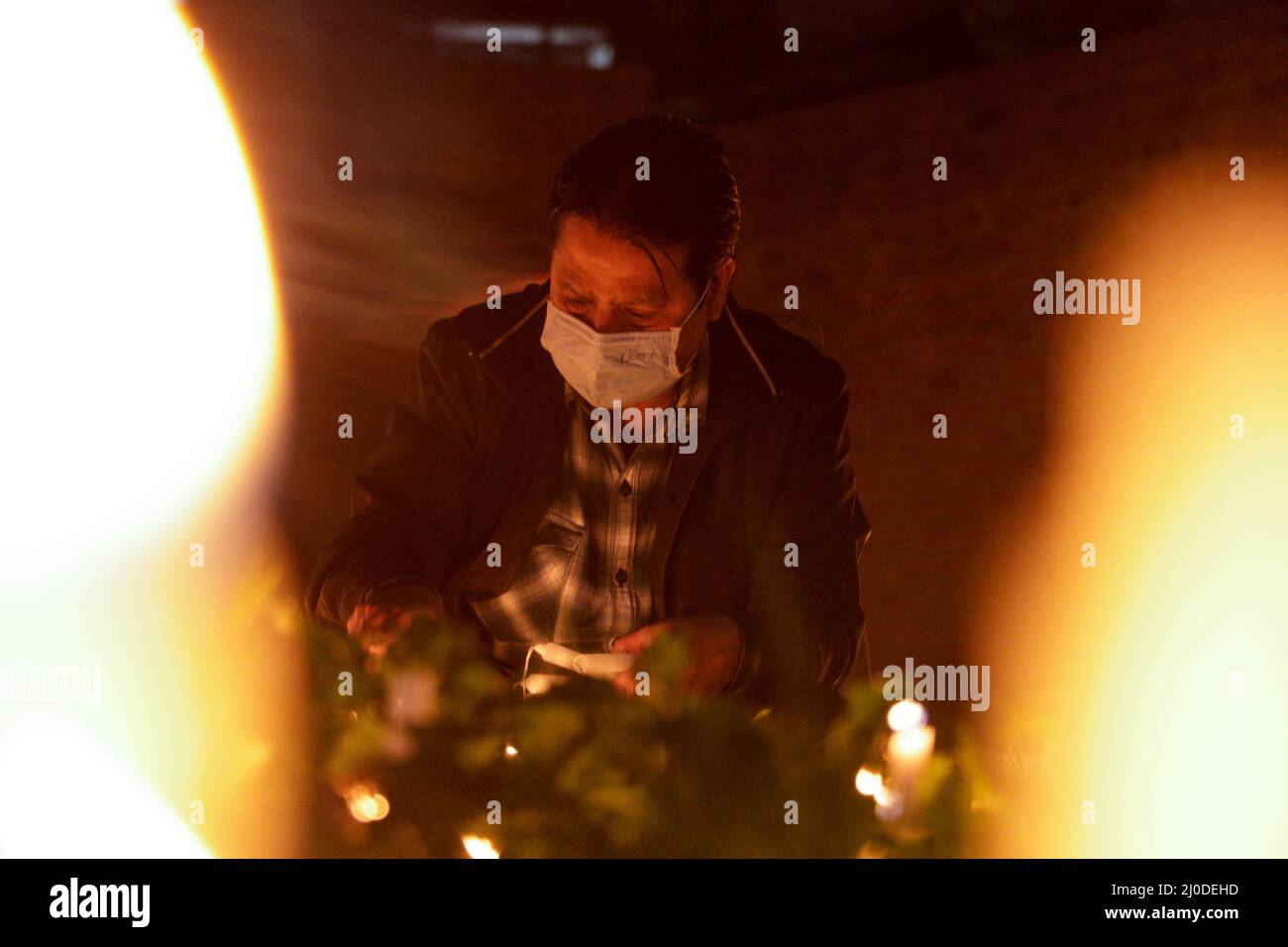 A Kashmiri Shiite Muslim light candles 