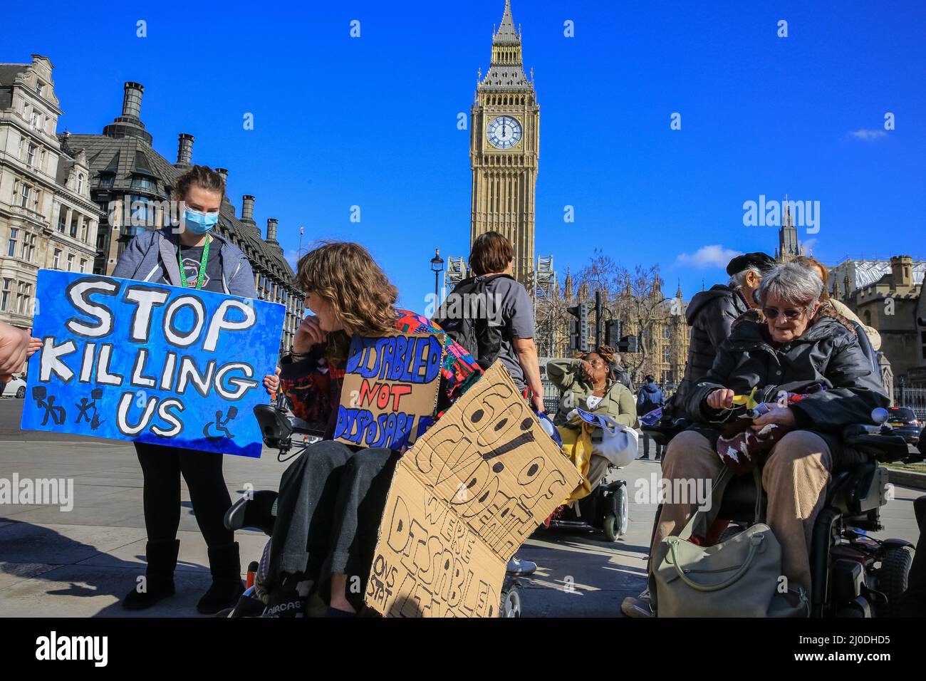 London, UK. 18th Mar, 2022. Protesters on Parliament Square. A rally organised by the Disabled People's Direct Action Networks see people protesting against what they perceive as a failure by government to protect disabled people adequately during the ongoing covid pandemic. Credit: Imageplotter/Alamy Live News Stock Photo