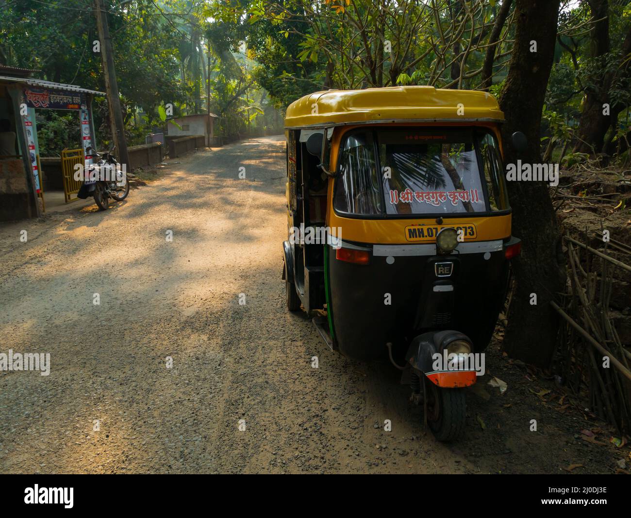 Malvan, INDIA - December 19, 2021 : Auto rickshaw standing on a road in ...