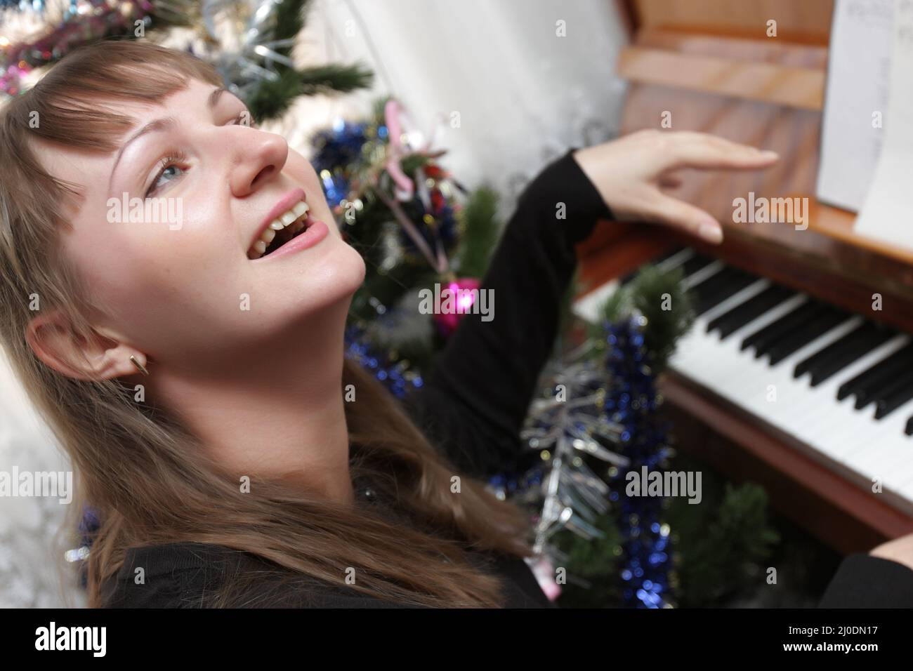 The pianist plays the piano at home Stock Photo