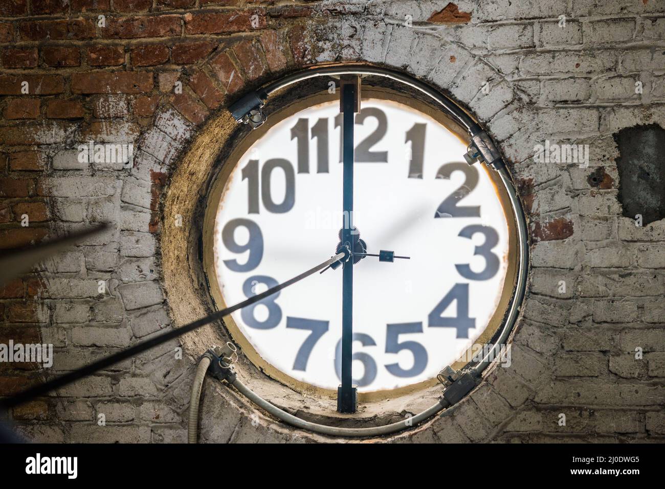 Big old clock embeded on the wall Stock Photo
