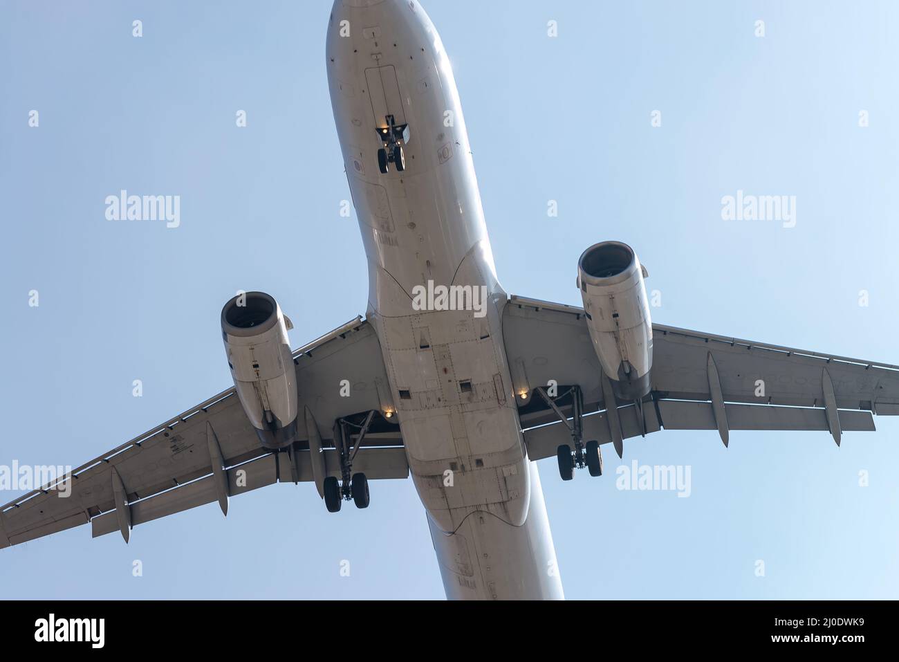 The aircraft approaching the airport to land Stock Photo