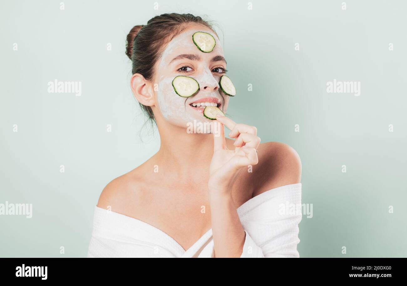 Natural beauty. Girl chilling making clay facial mask with cucumber
