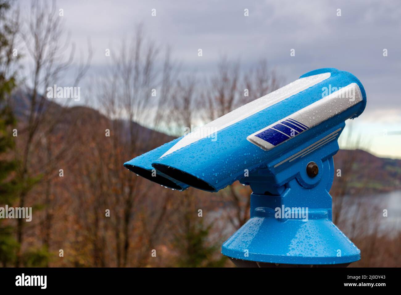 Binoculars on background of blue sky Stock Photo