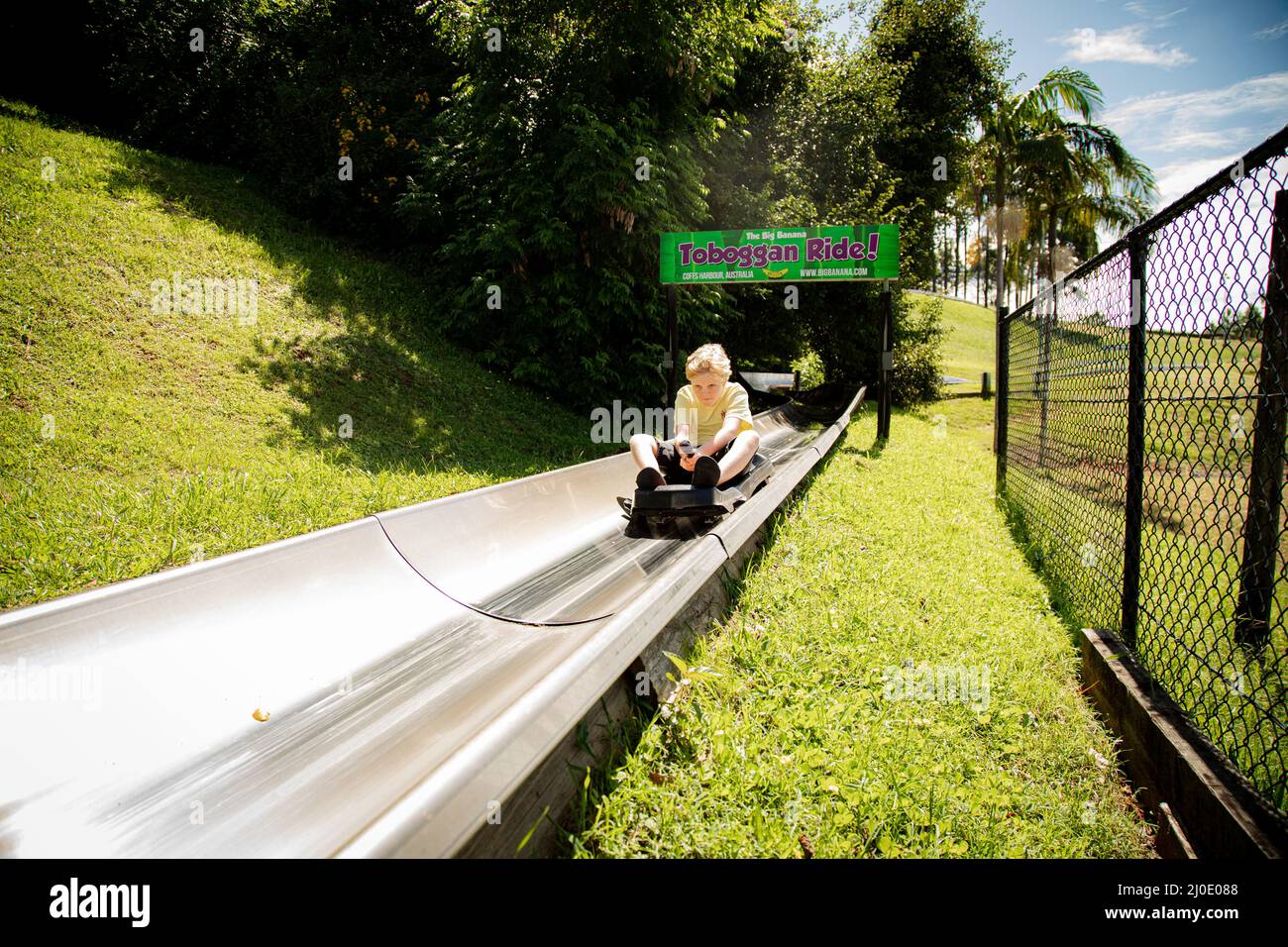 Coffs Harbour, NSW Australia 17 March 2022 Kids riding the toboggan