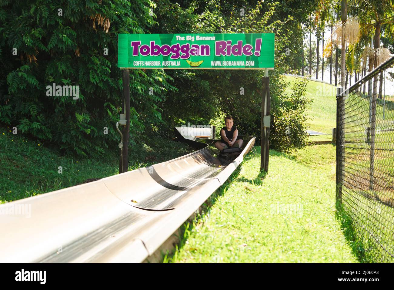 Coffs Harbour, NSW Australia 17 March 2022 Kids riding the toboggan