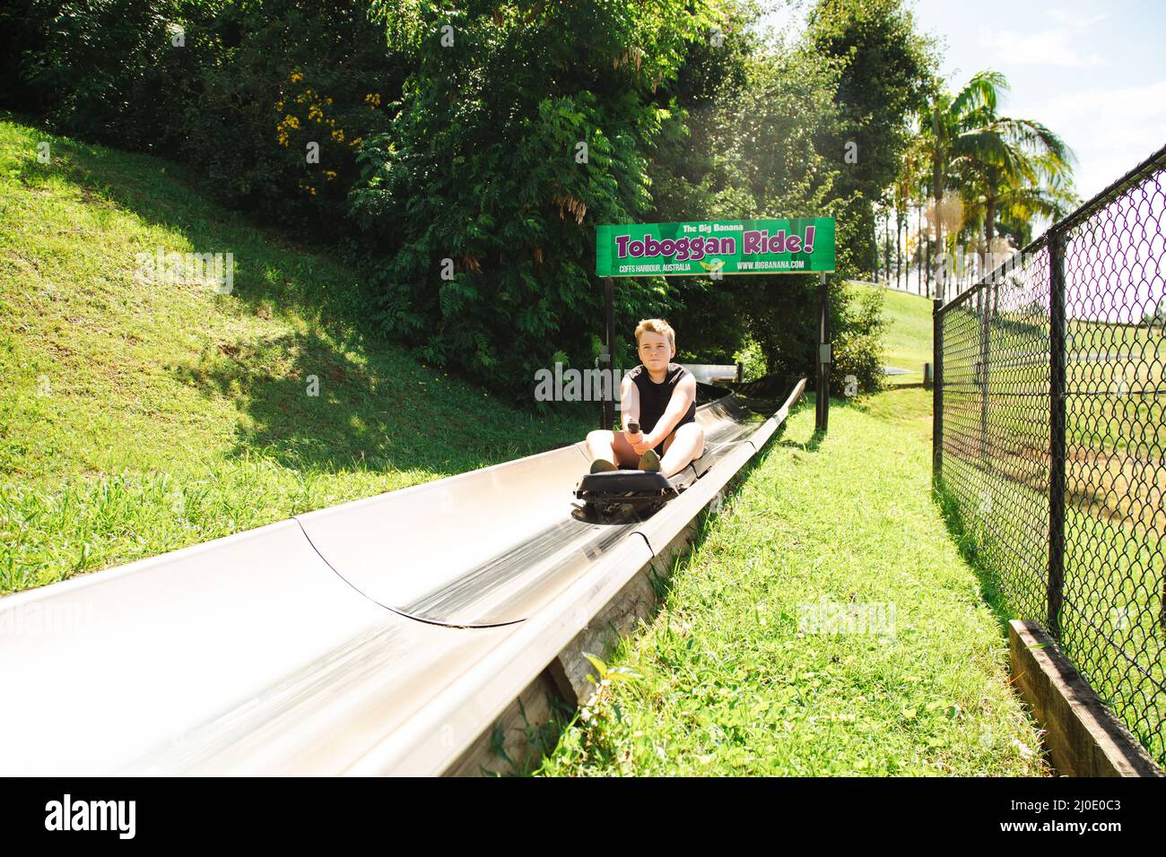 Coffs Harbour, NSW Australia 17 March 2022 Kids riding the toboggan