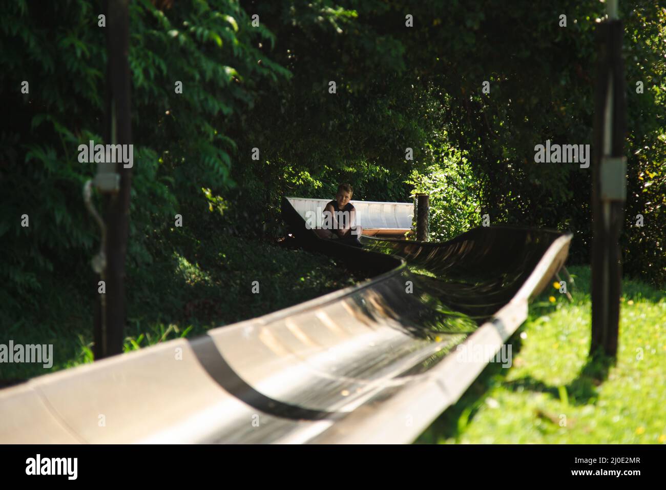Kids riding the toboggan attraction at the Big Banana Fun Park, Coffs