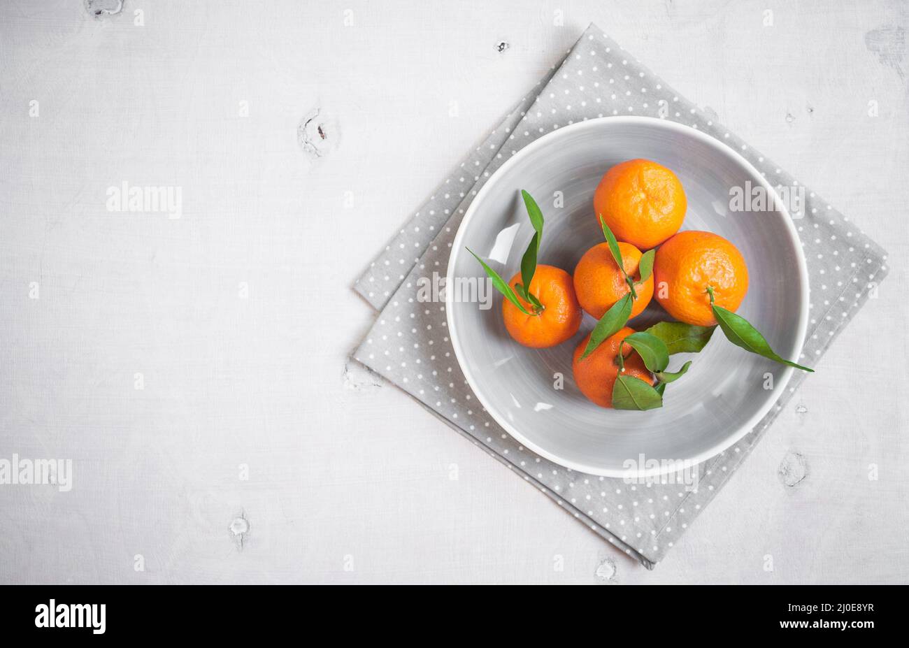 Tangerines on white wooden background. Free space for text Stock Photo