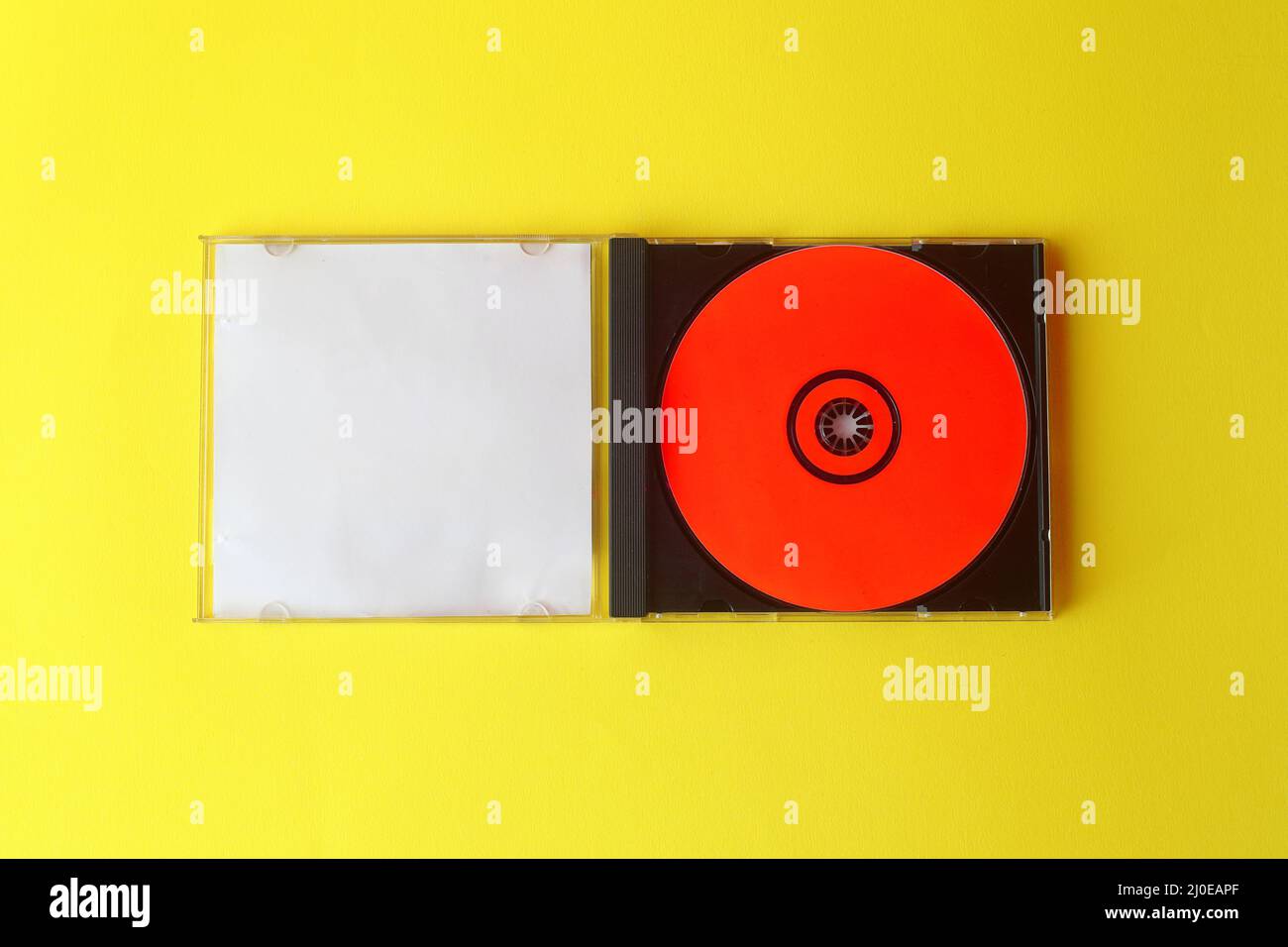 Close-Up Of Compact Discs Over White Background Stock Photo