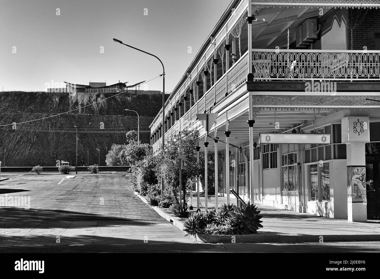 Black-white contrast streets and historic buildings of Broken hill australian outback mining town towards Line of Lode memorial. Stock Photo