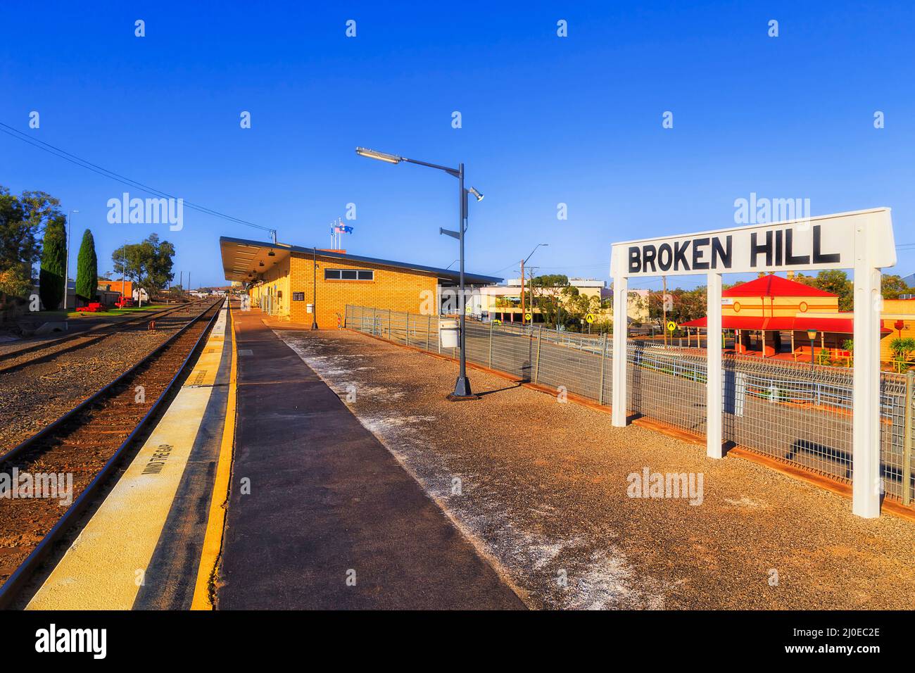 Broken hill sign post with city name at platform of Silver city train station. Stock Photo