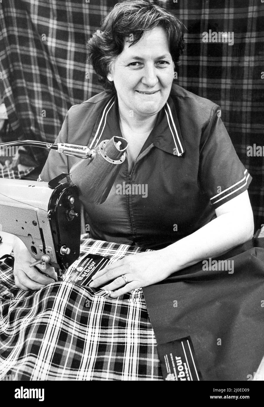 Mrs. Marjorie Landles a the J Barbour factory making the all weather Game Fare breeches for Her Majesty the Queen in 1979 Stock Photo