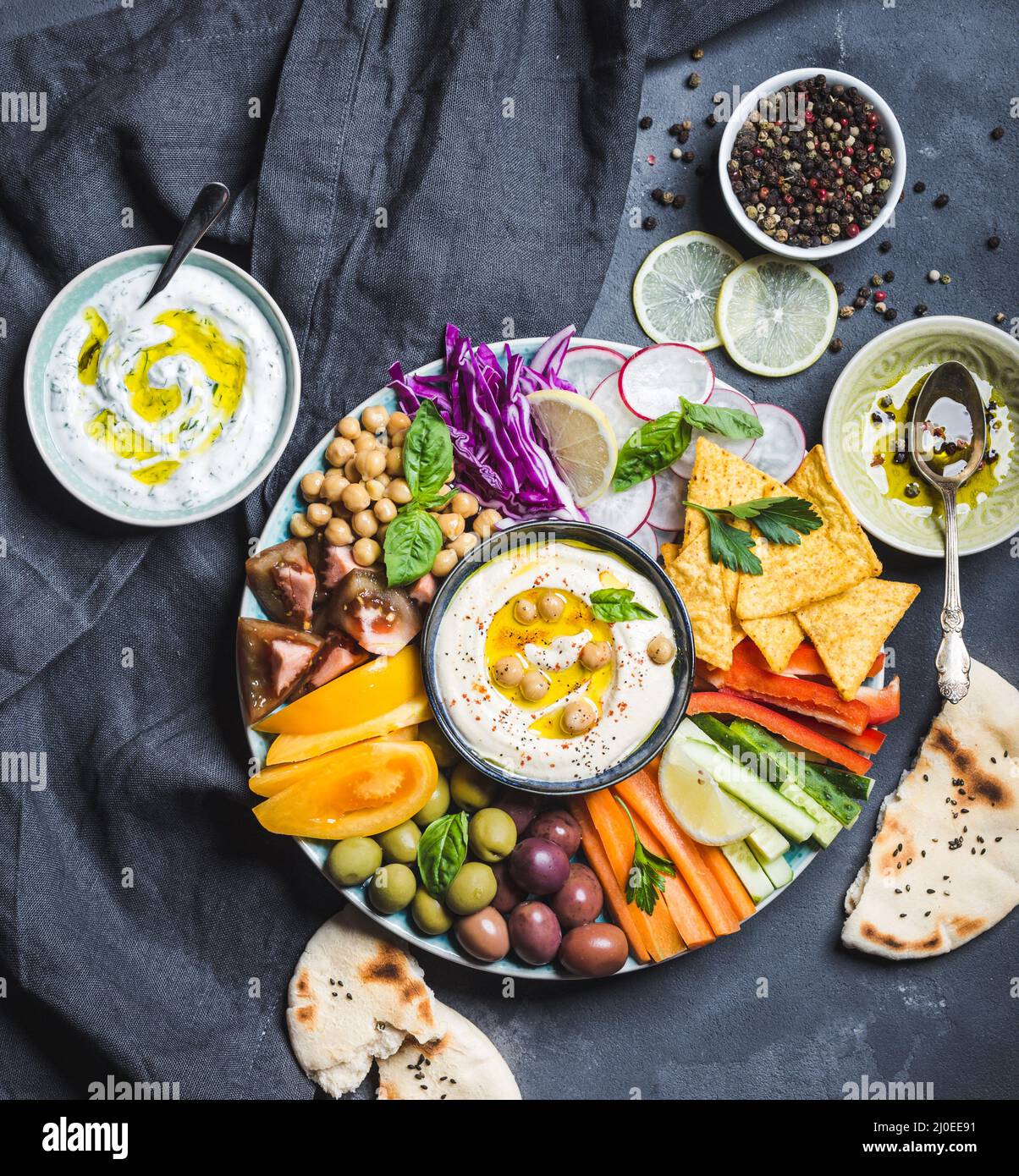 Hummus platter with assorted snacks Stock Photo Alamy