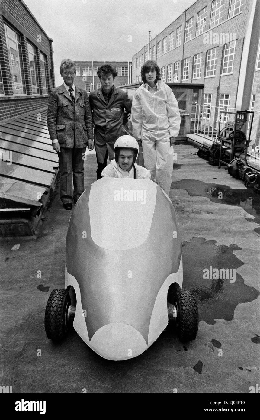 Picture shows students and lecturer at Garretts Green Technical College in Birmingham pictured with their electric electronic car.   At work on the car Daryl Boardman (18) in foreground checks cars batteries, with Michael Parry (18) in drivers seat, also in the picture are Mr. John West, lecturer at the collage on the Motor Vehicle Body Courses and 18 year old Paul Radcliffe.  Photo taken 15th August 1979. Stock Photo