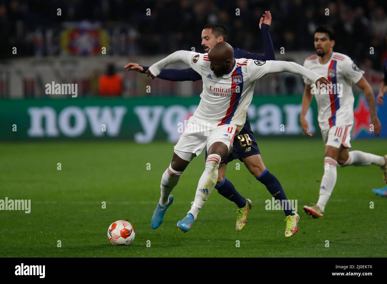 Moussa DEMBELE of Lyon and Bruno COSTA of Porto during the UEFA Europa League, Round of 16, 2nd leg football match between Olympique Lyonnais (Lyon) and FC Porto on March 17, 2022 at Groupama stadium in Decines-Charpieu near Lyon, France - Photo Romain Biard / Isports / DPPI Stock Photo