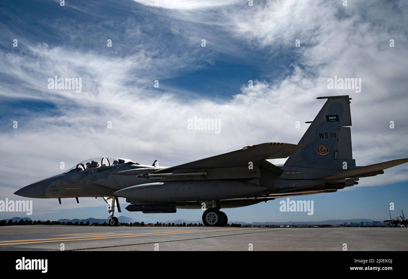 A Royal Saudi Air Force F-15SA assigned to the Royal Saudi Air Force, Weapons School, Dhahran, Saudi Arabia, taxis out for a Red Flag-Nellis 22-2 mission at Nellis Air Force Base, Nevada, March 14, 2022. Red Flag exercises are conducted on the 5,000 square mile bombing and gunnery ranges of the Nevada Test and Training Range (U.S. Air Force photo by William R. Lewis) Stock Photo