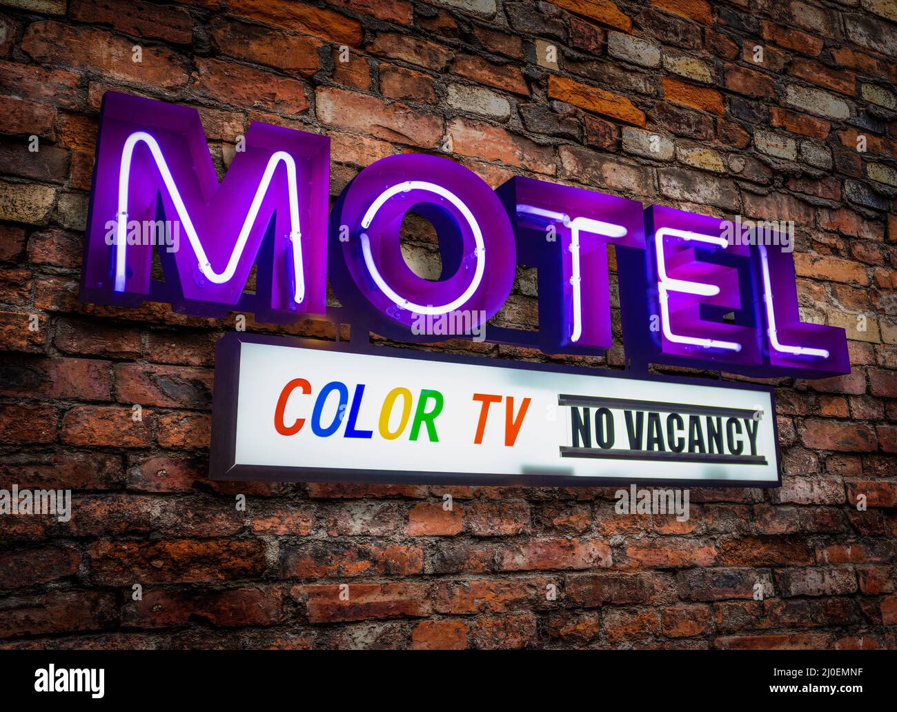 Retro Neon Motel Sign With Color TV Stock Photo