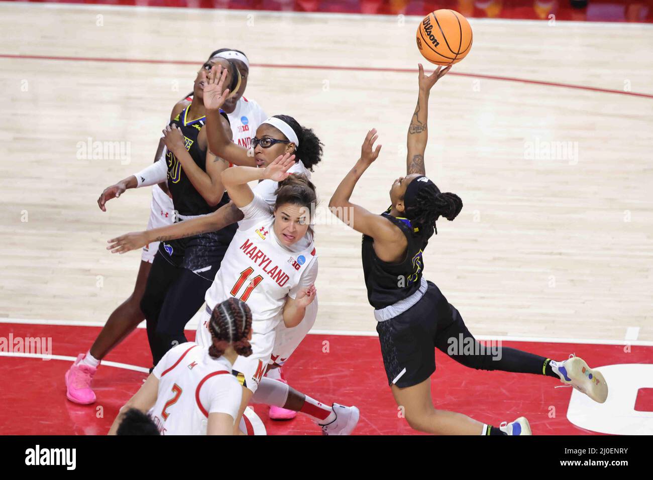 College Park, MD, USA. 18th Mar, 2022. Delaware guard TYI SKINNER (3) drives to the basket as Maryland guard KATIE BENZAN (11) looks on defends during the opening round of the women's NCAA tournament between between No. 13 Delaware and No. 4 Maryland Friday, March 18, 2022; at the Xfinity Center on the campus of the University of Maryland in College Park, MD. Credit: ZUMA Press, Inc./Alamy Live News Stock Photo