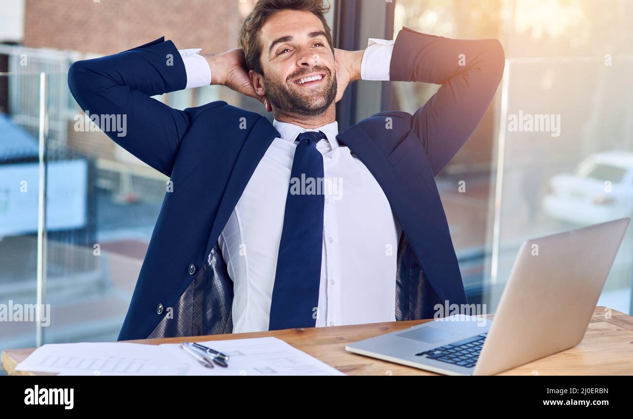Business is going good. Shot of a businessman looking relaxed in his office. Stock Photo