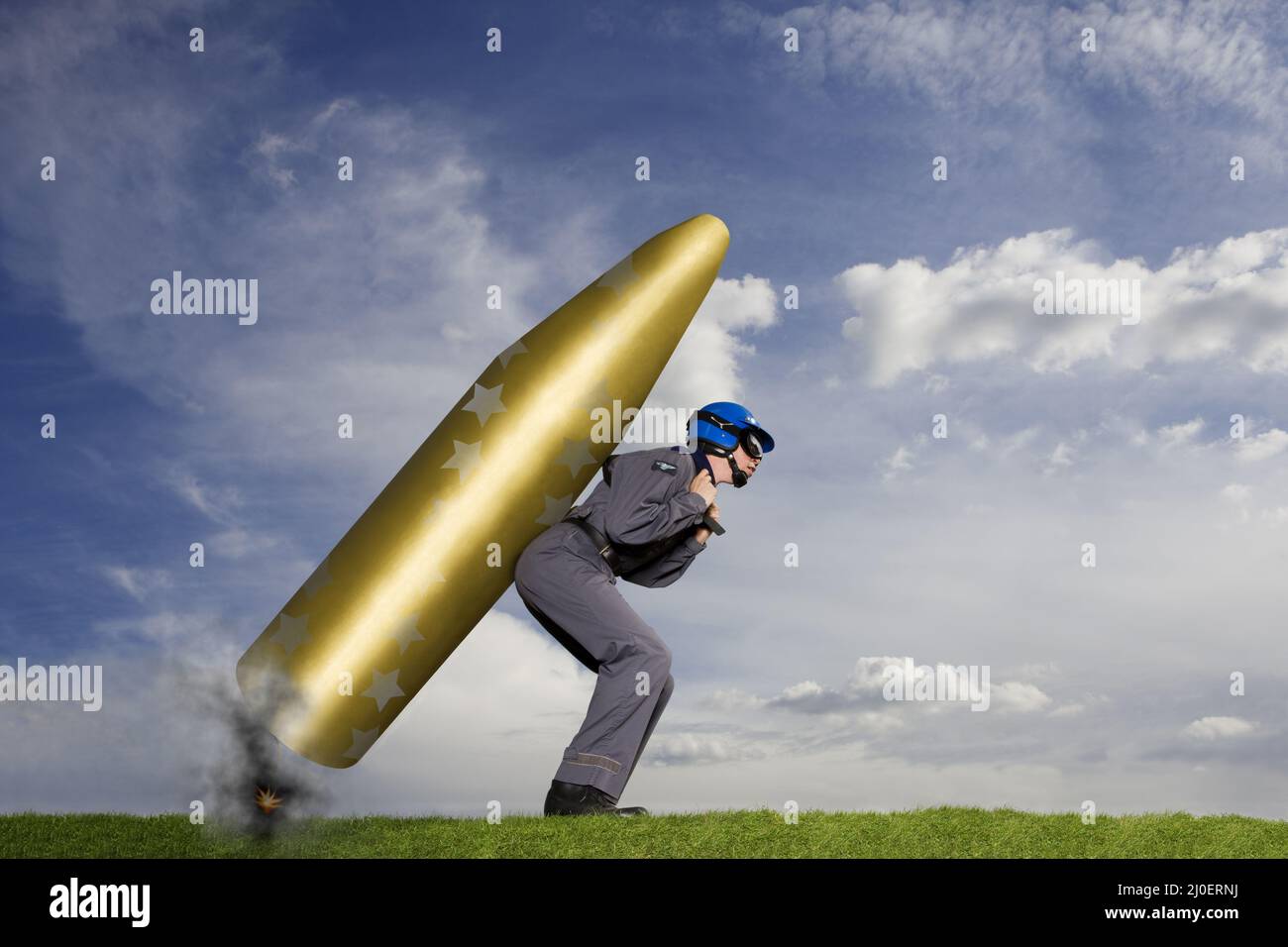 Stuntman with large rocket strapped to his back ready for take off Stock Photo