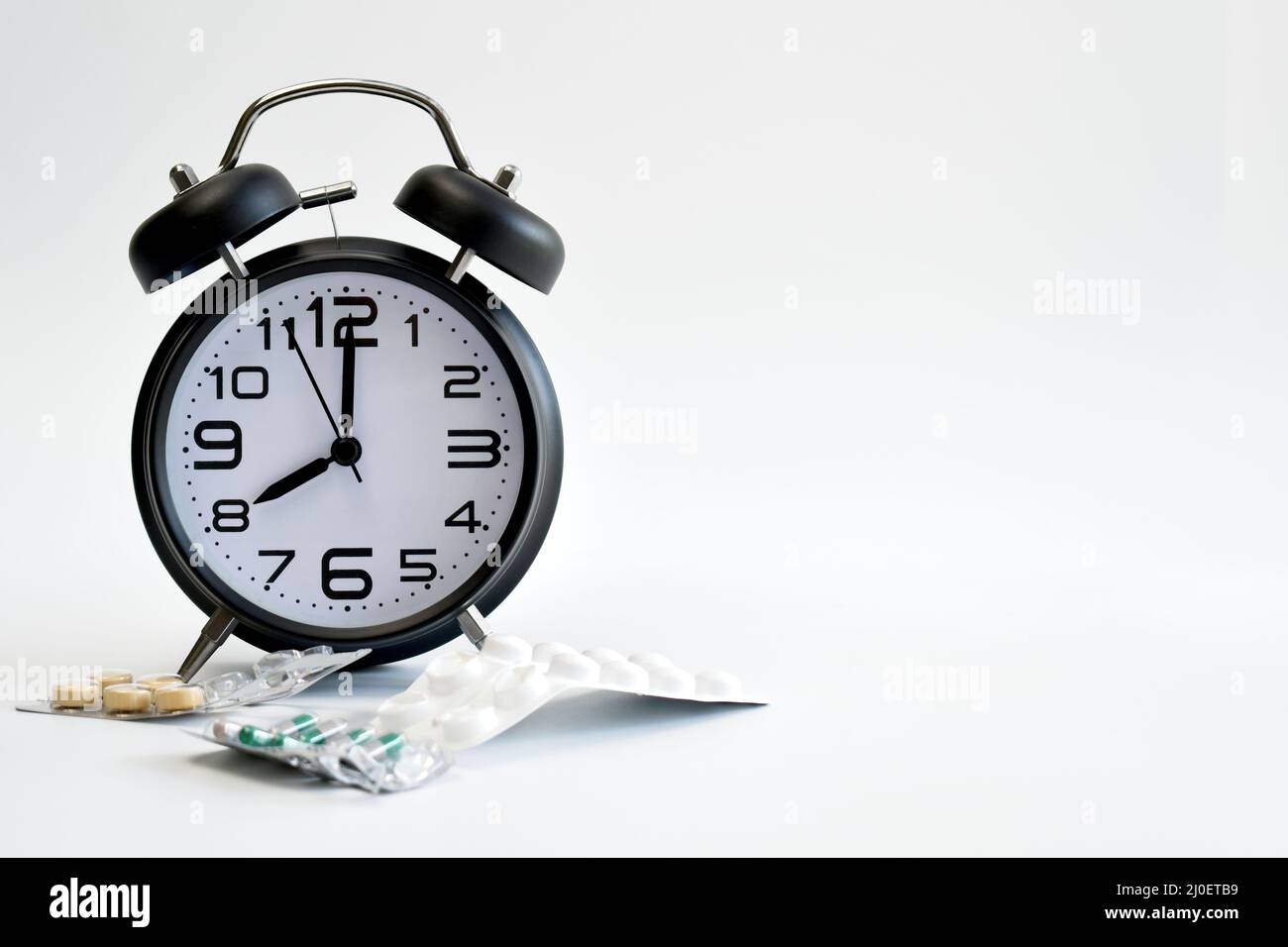 Alarm clock with tablets Stock Photo Alamy