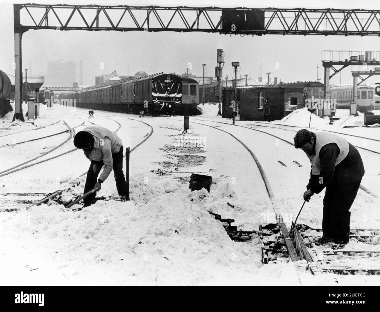 Workmen use gas heaters to free the points at Cardiff Station, Cardiff Central railway station, South Wales Main Line in Cardiff, Wales, 20th February 1978. Stock Photo