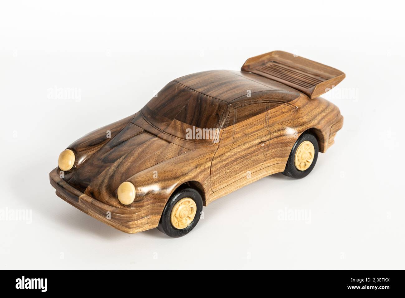 Wooden toy car on white background Stock Photo - Alamy