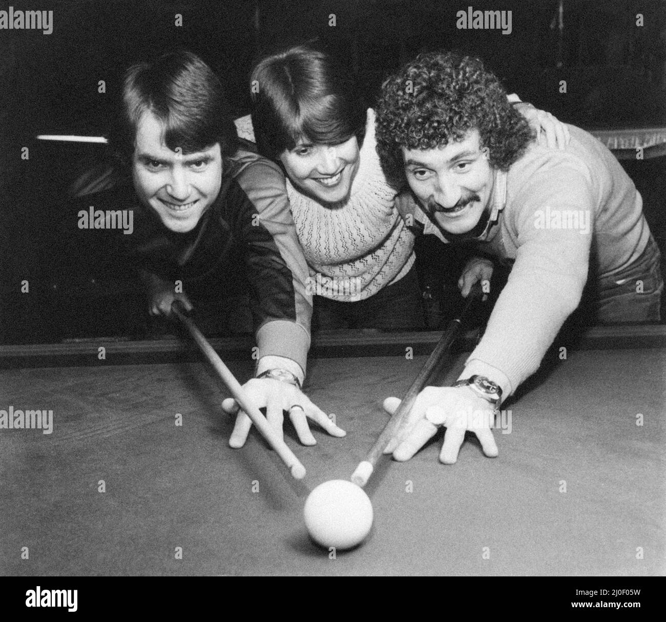 Terry McDermott, Liverpool Midfielder, pictured with girlfriend Val Wilcock and her brother Bob, playing snooker at Bury Social Club, 11th February 1980. Stock Photo