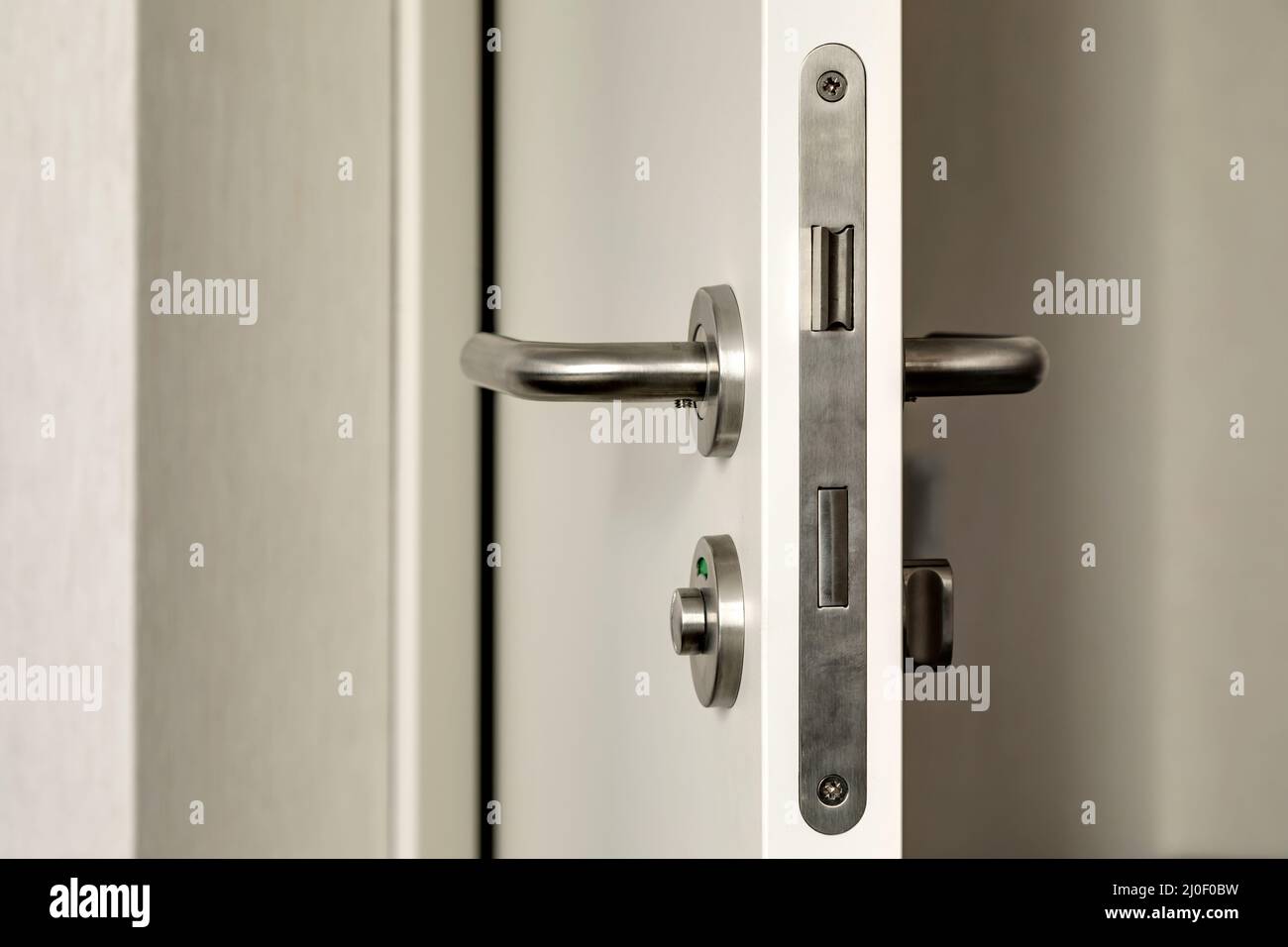 The front door with a door handle Stock Photo - Alamy