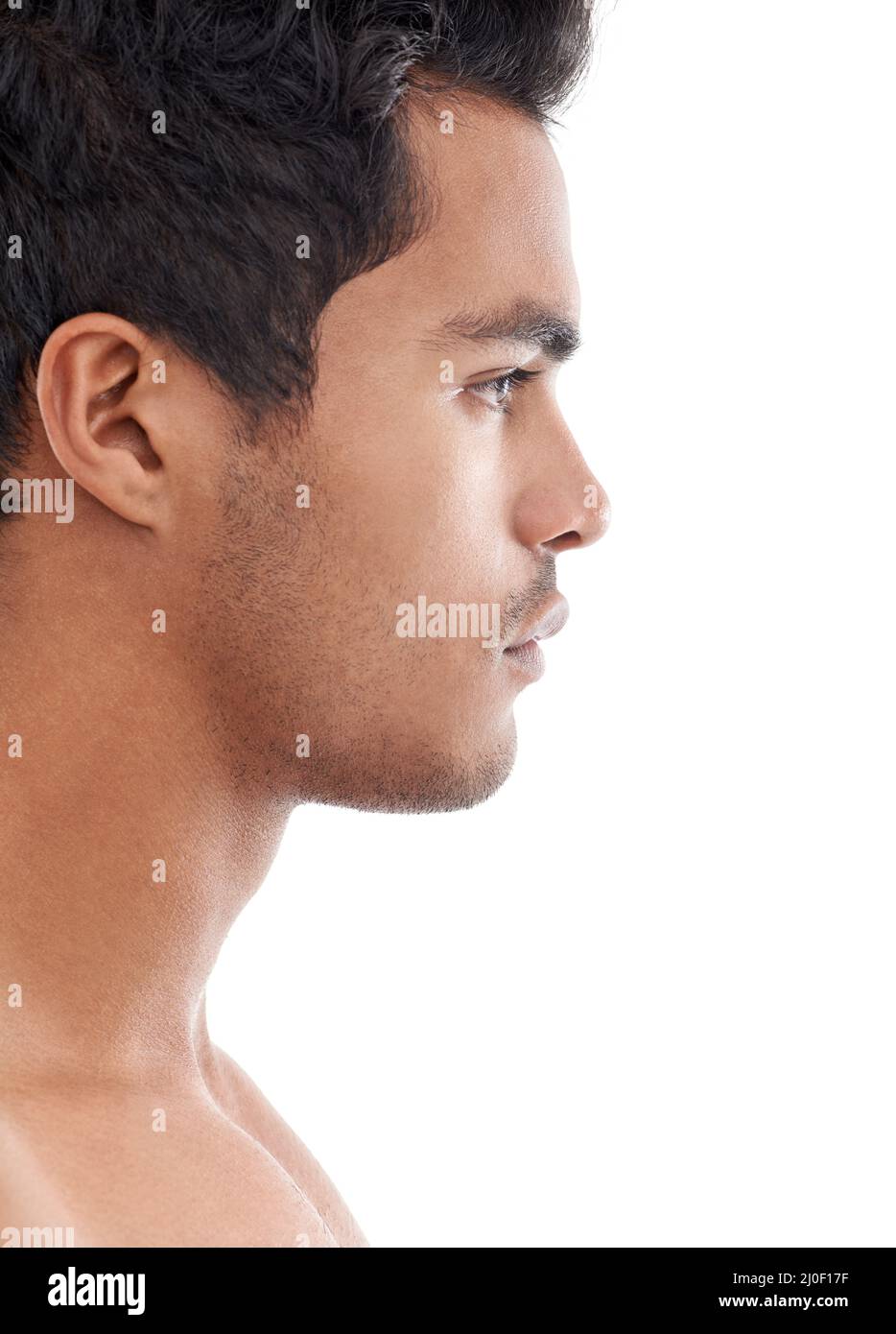 Serious profile. Profile shot of a handsome young man isolated on white. Stock Photo