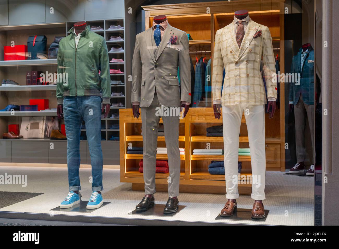 Male dummy in a shop window. Sale of men's clothing. Stock Photo