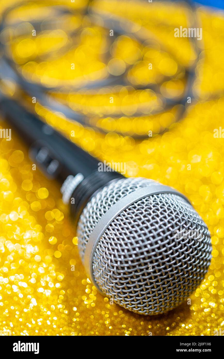 Professional dynamic microphone. Concert microphone for voice recording and sound enhancement. Sound equipment. Stock Photo