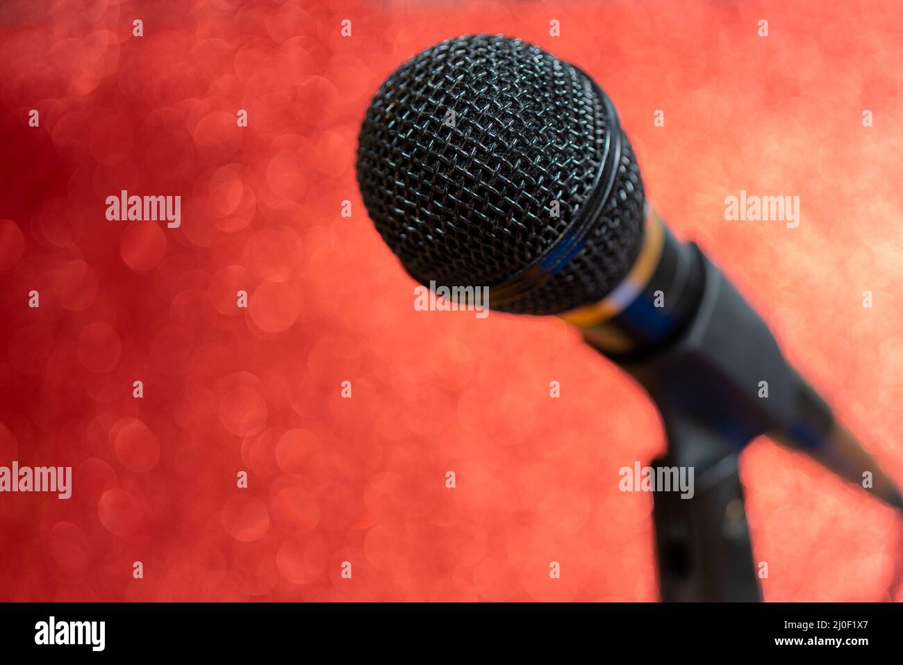 Professional dynamic microphone. Concert microphone for voice recording and sound enhancement. Sound equipment. Stock Photo