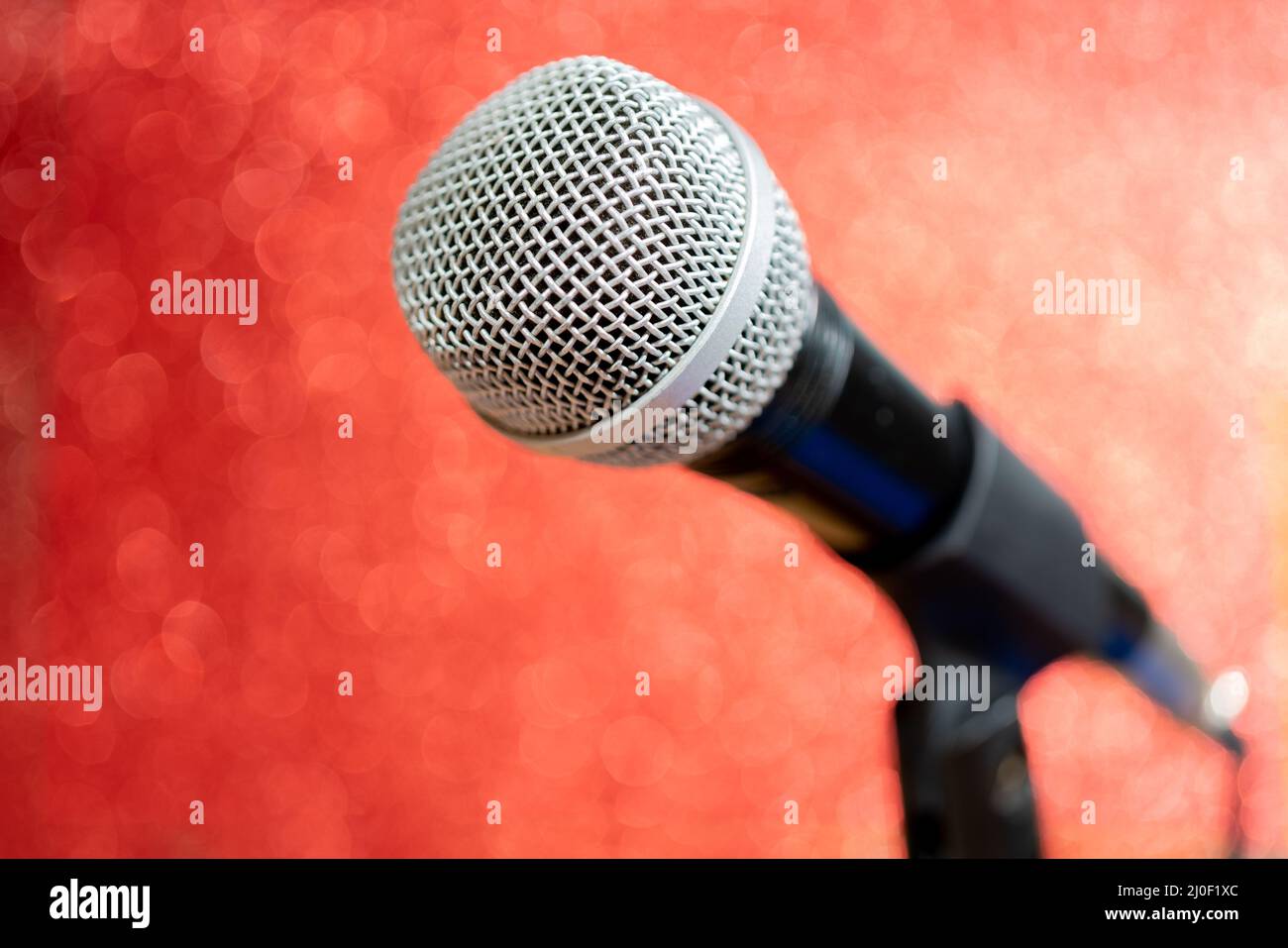 Professional dynamic microphone. Concert microphone for voice recording and sound enhancement. Sound equipment. Stock Photo