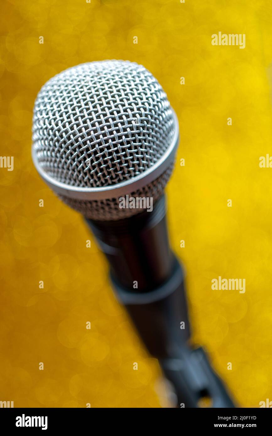 Professional dynamic microphone. Concert microphone for voice recording and sound enhancement. Sound equipment. Stock Photo
