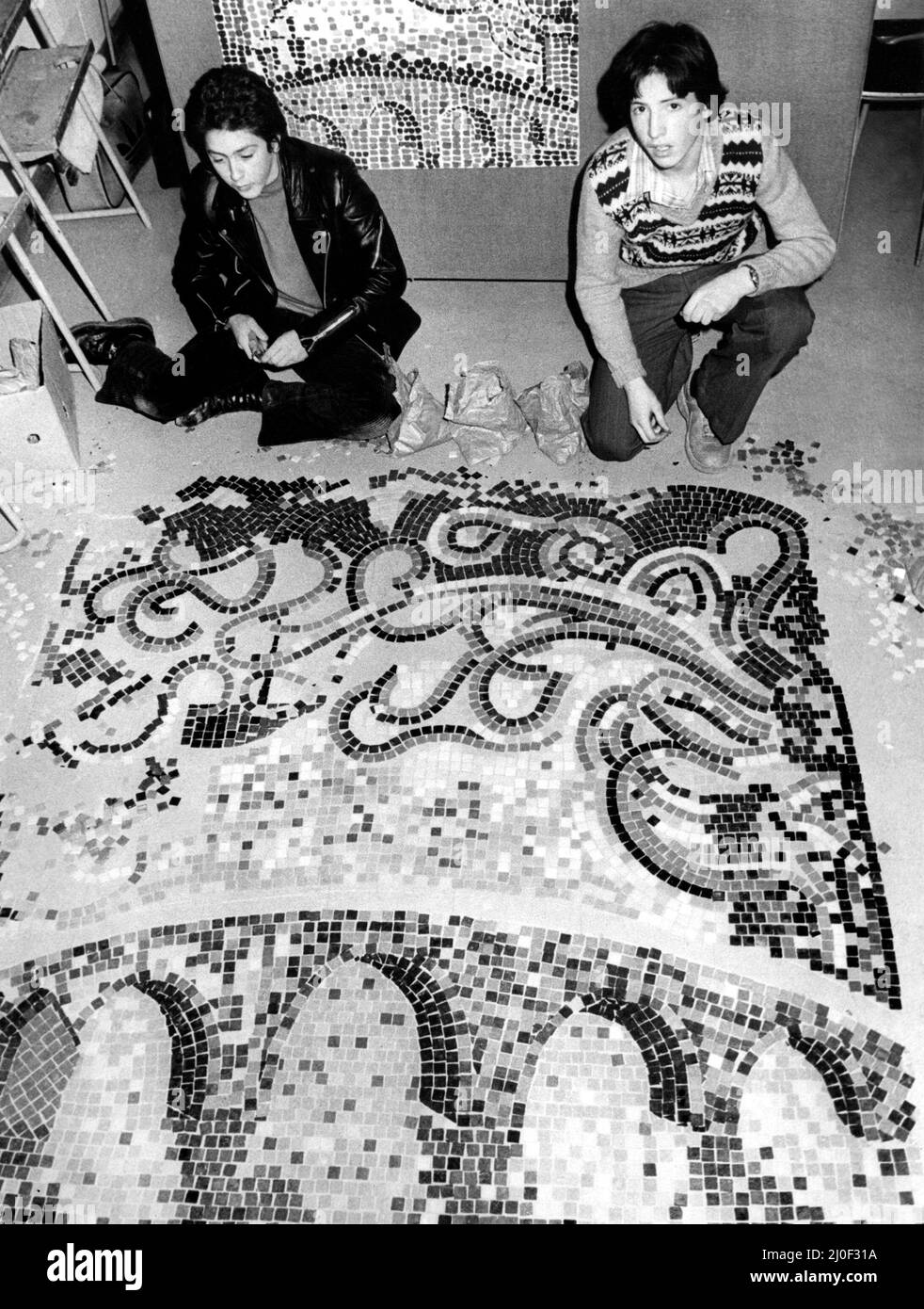 The City of Newcastle 900 Years Anniversary Celebrations 1980 - The anniversary year celebrate the founding of the New Castle in 1080 by Robert Curtois, son of William the Conqueror - West Denton High School pupils Paul Robinson and Graham Smith have just finished a six-foot square mosaic in the subway beneath Jesmond Road. 26th February, 1980 Stock Photo