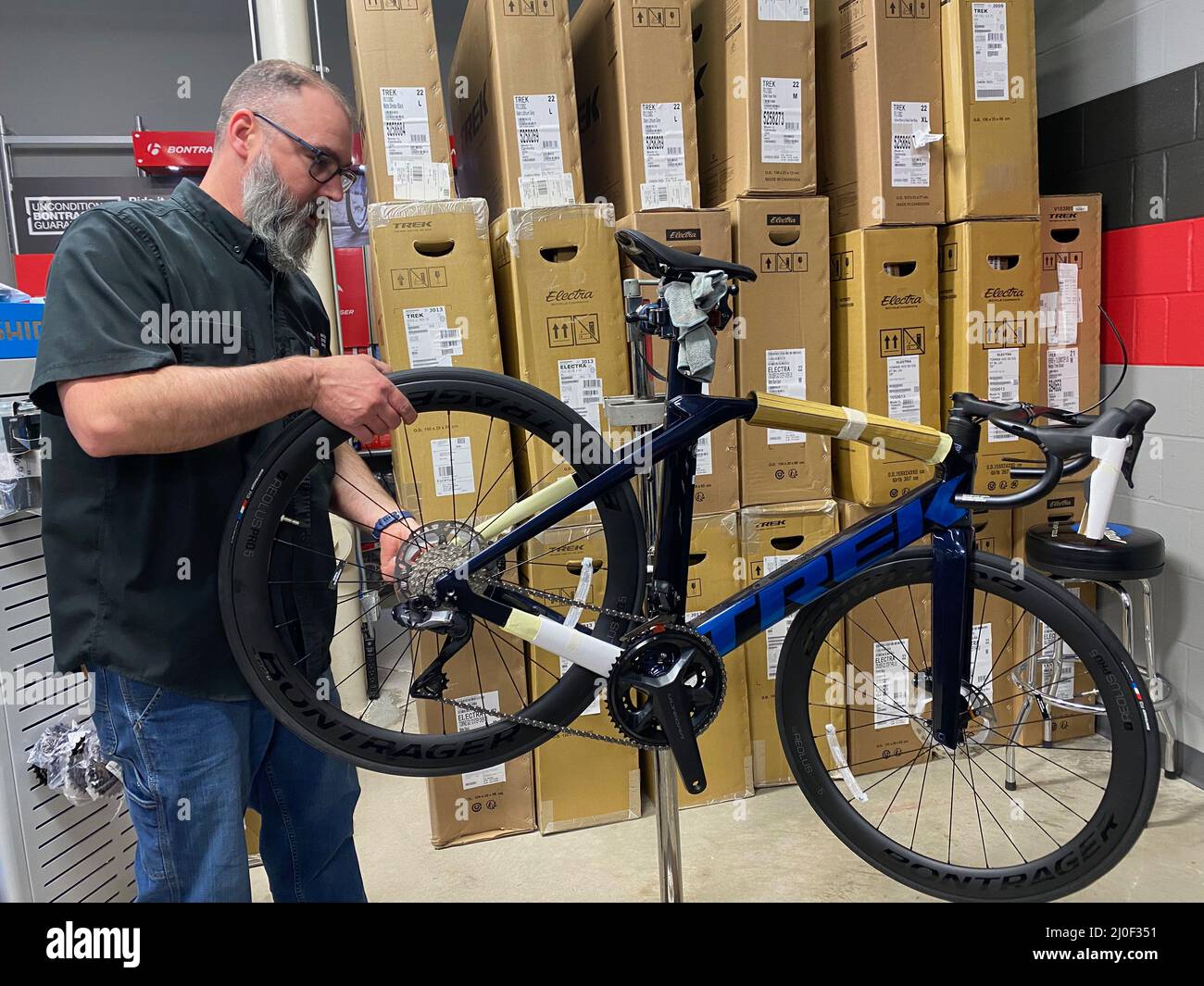 Mount Pleasant, Wisconsin, USA. 11th Mar, 2022. LEE AYLOR assembles a new  Trek Madone SL7 bicycle at a Wisconsin Trek dealer Friday March 11, 2022.  Although the bike shop is getting new
