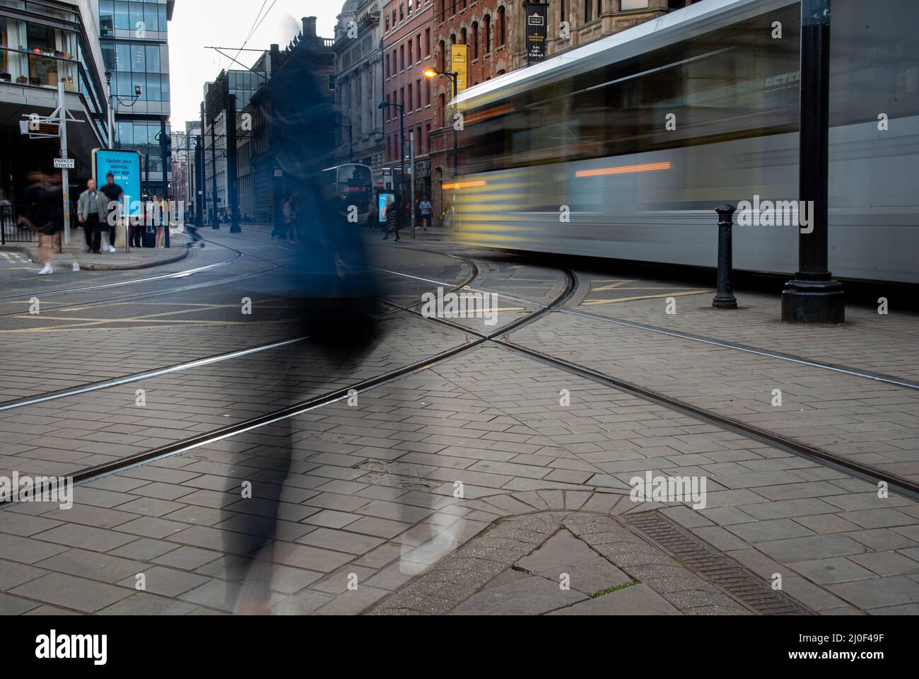 Unrecognizable people on the move, Manchester United Kingdom Stock Photo