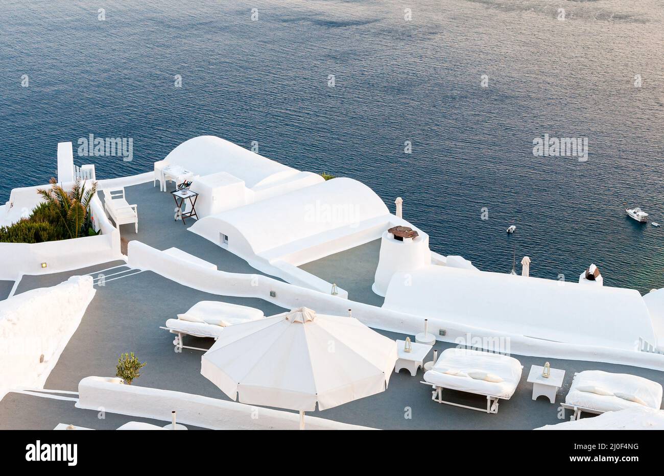 Santorini traditional white architecture, and blue sea Cyclades Greek islands, Greece. Stock Photo