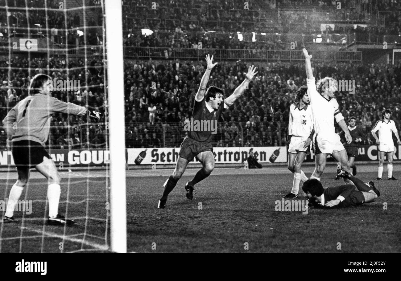 European Cup Semi Final First leg match at the Rheinstadion, Dusseldorf. Borussia Moenchengladbach 2  v Liverpool 1. Emlyn Hughes celebrates as Moenchengladbach player Berti Vogts  protests in vain against David Johnson's 88th minute goal. The German team went on to win the match two one but Liverpool won the second leg at Anfield 3-0 to progress to their second consecutive European Cup Final. 29th March 1978. Stock Photo