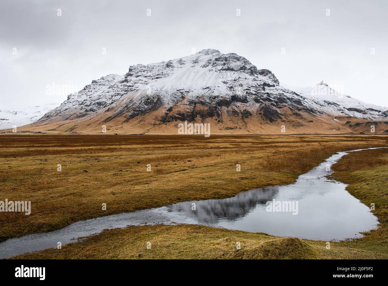 Icelandic Landscape with katla volcano reflected on water. Iceland Stock Photo